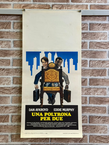 Locandina di cinema - Una poltrona per due