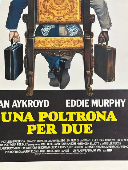 Locandina di cinema - Una poltrona per due