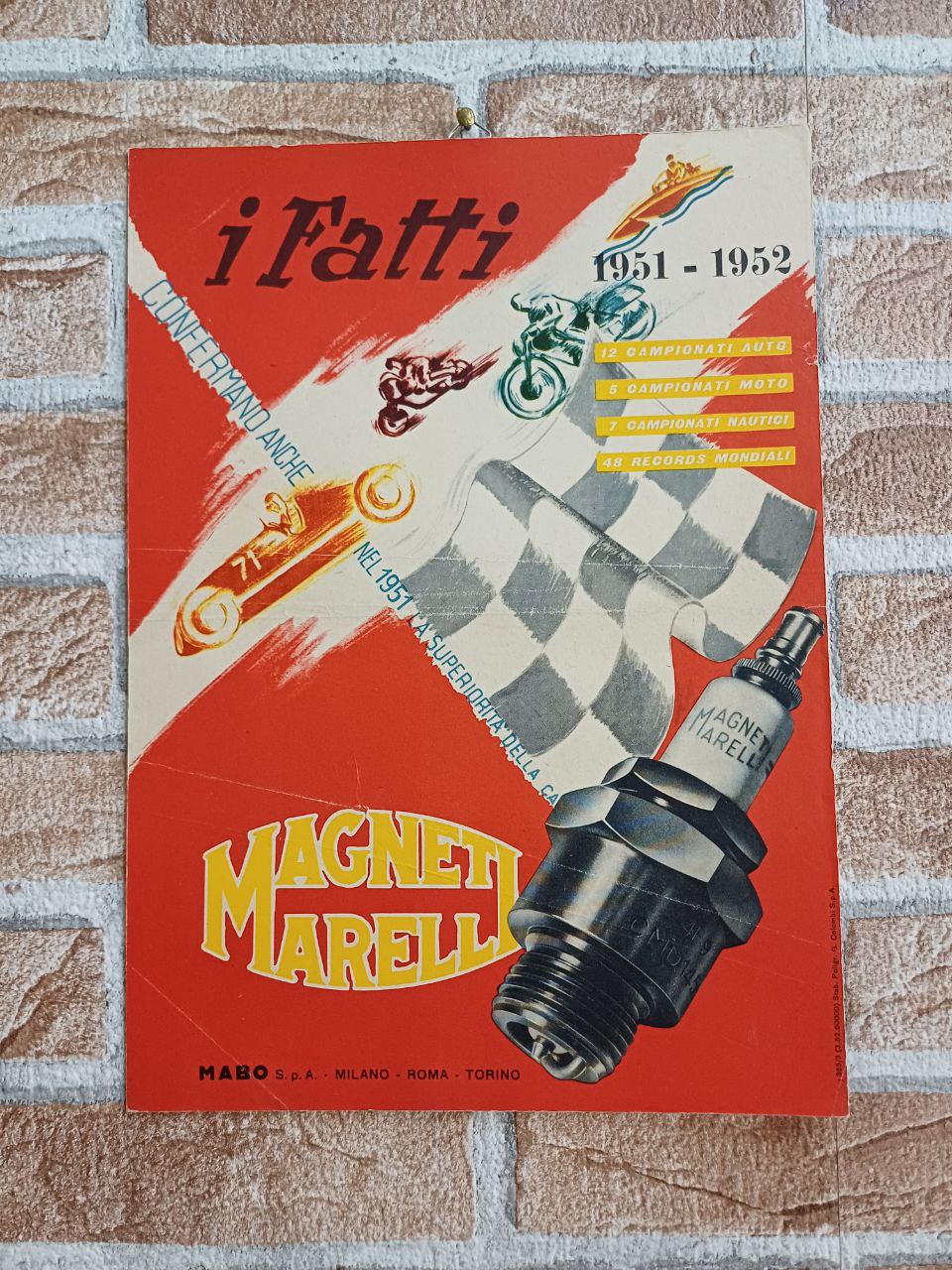 Cartonato pubblicitario I Fatti - Magneti Marelli